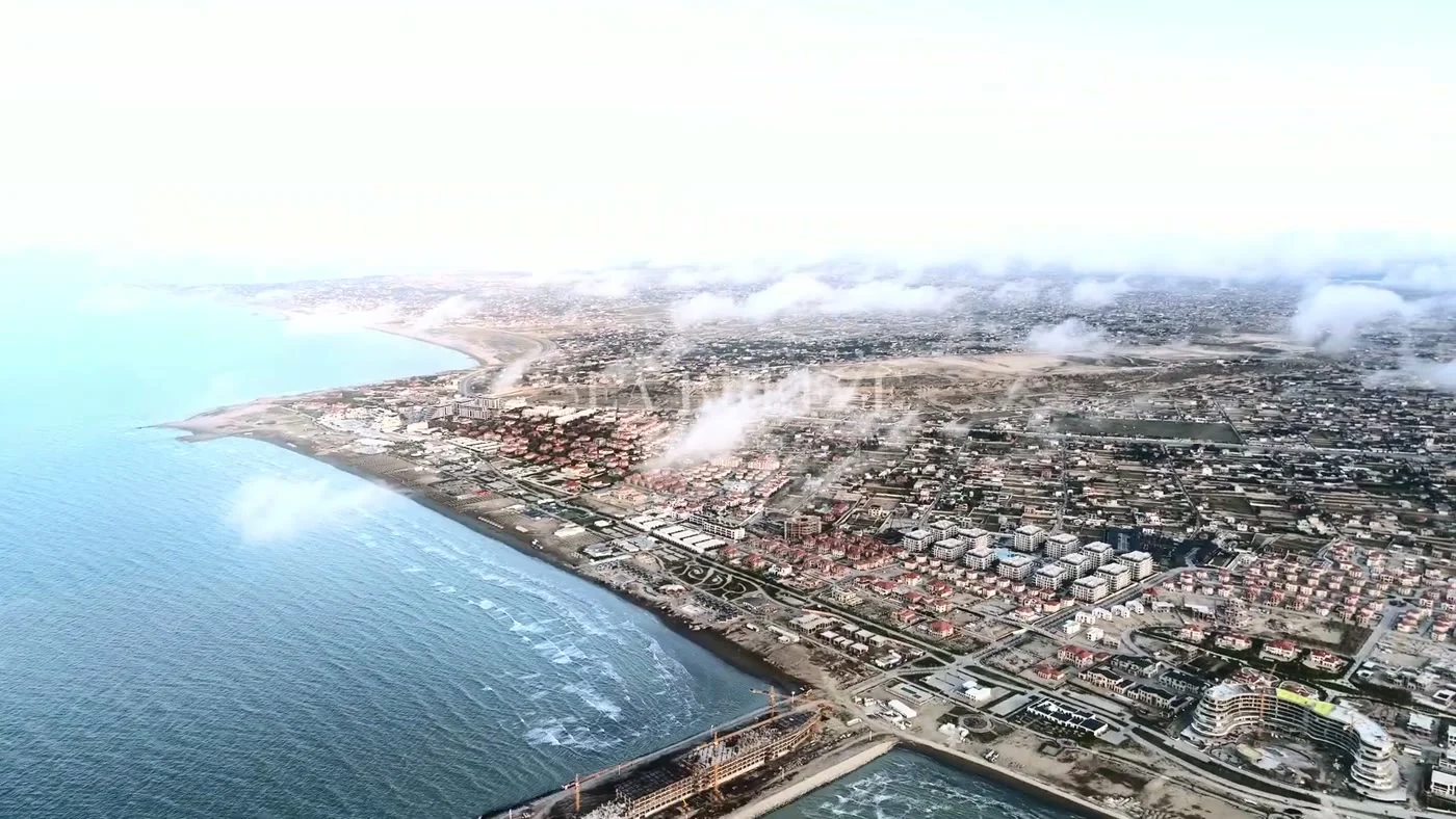 The resort shore and the site's spit from above