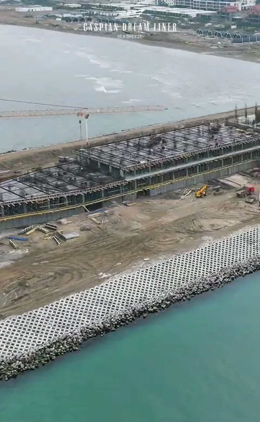 The spit from above: the building reaches out to sea